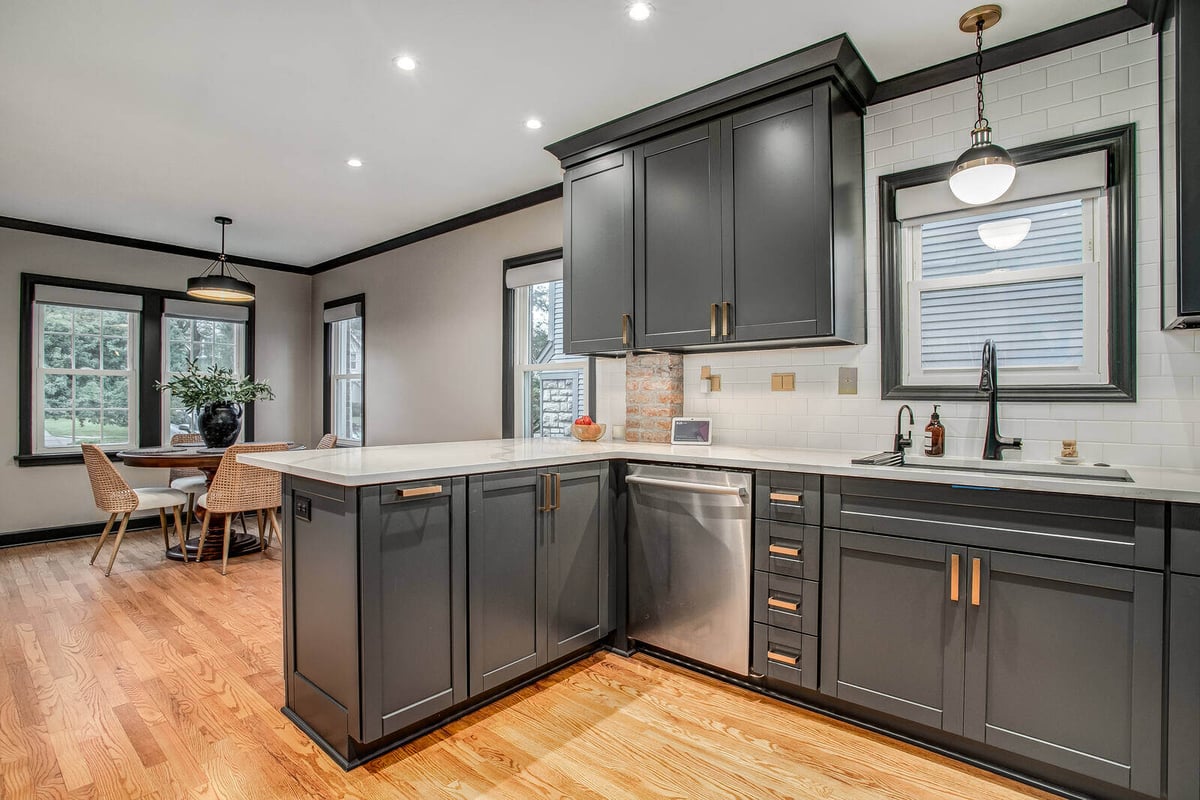Open-concept kitchen with an elegant island, high-end finishes, and a connected dining space in Waldo, MO