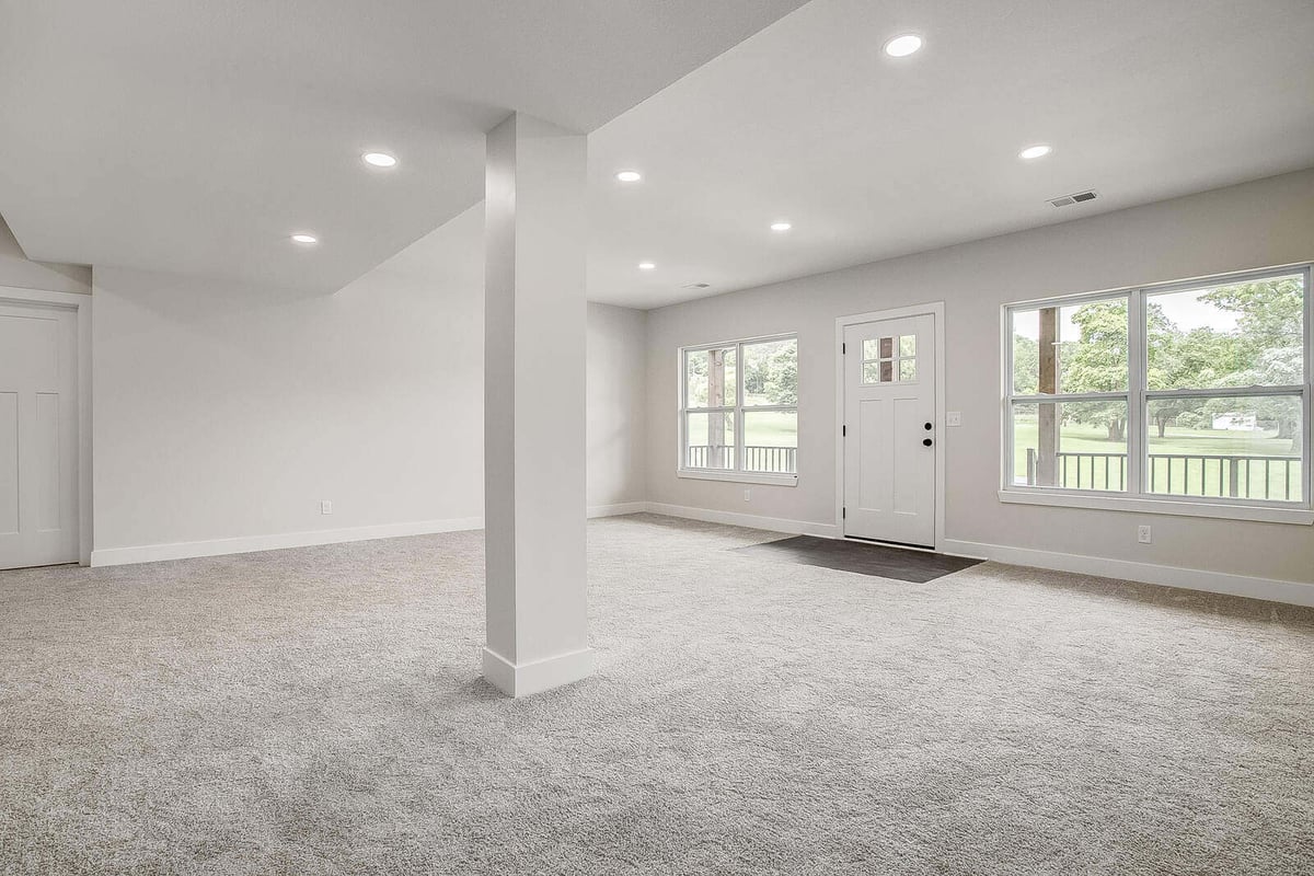 Open-concept living space in Kansas City, renovated by Top Shelf Home Builders during a whole home remodel