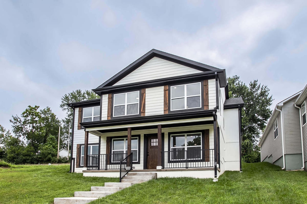 Top Shelf Home Builders whole home remodel in the Kansas City metro, featuring a modern farmhouse-style exterior.