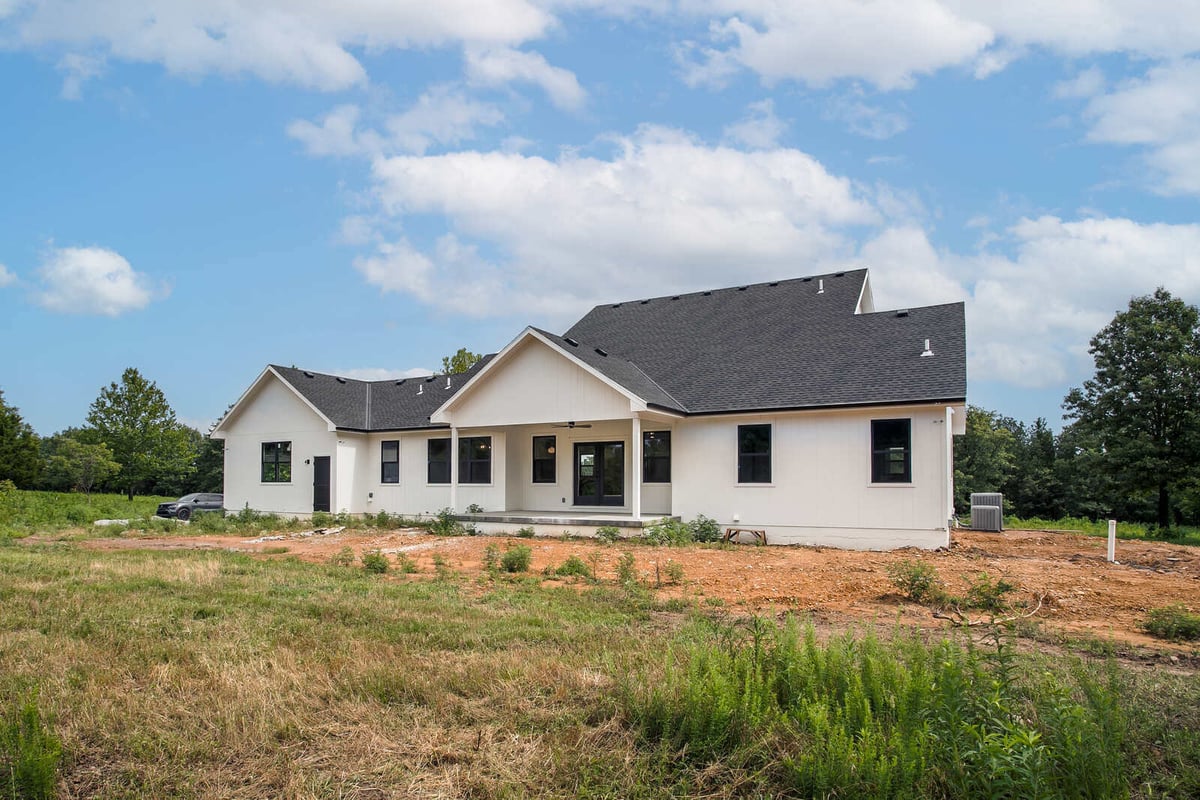 Newly remodeled home featuring a spacious backyard and open-concept living with large windows