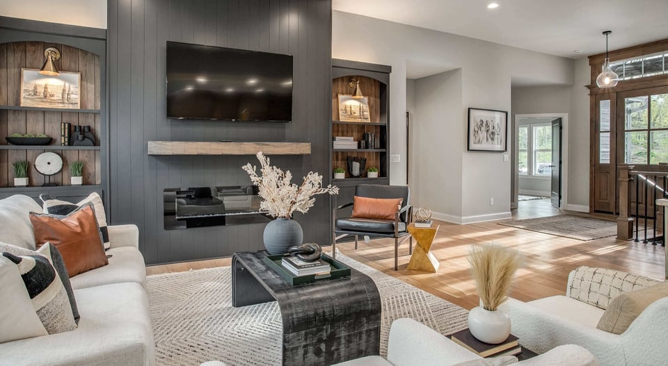 Beautifully remodeled kitchen with an oversized island, pendant lighting, and wood cabinetry by Top Shelf Home Builders