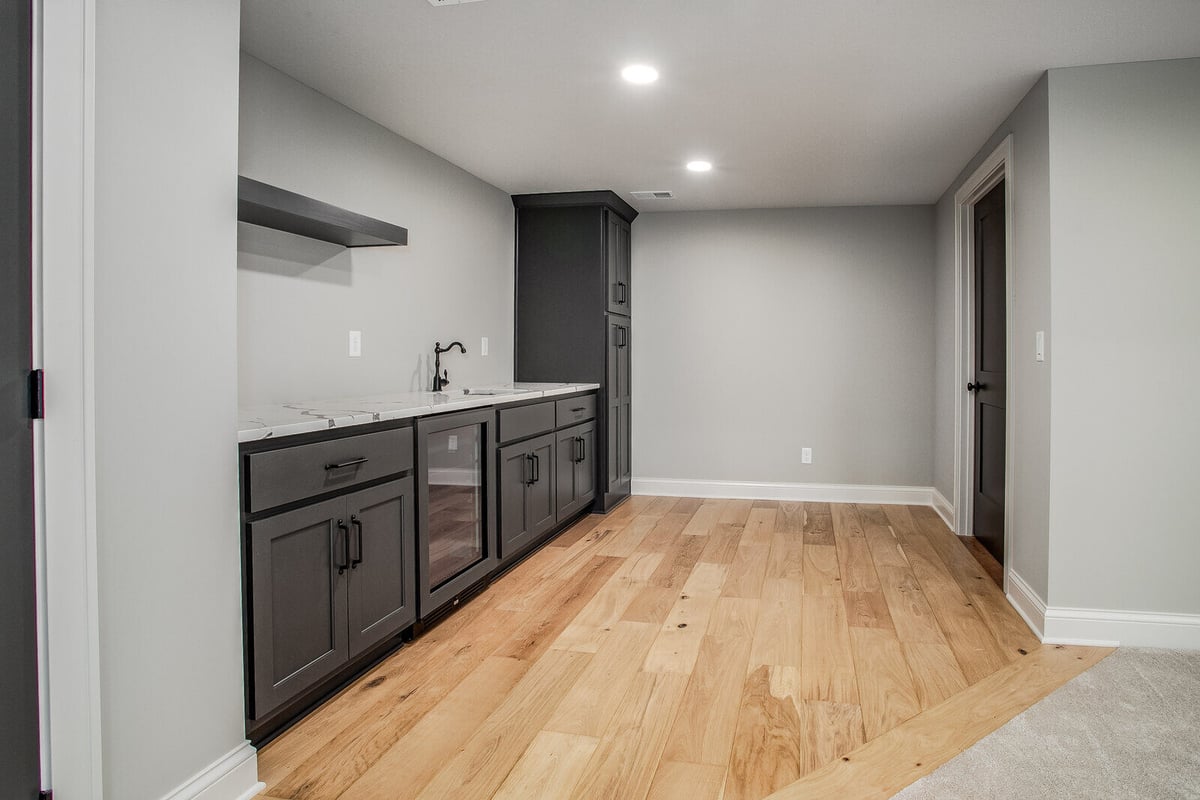 Large walk-in closet with built-in shelving and hanging space in a Metro Kansas City home remodel