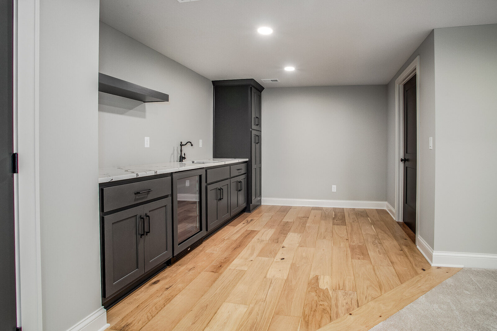 Large walk-in closet with built-in shelving and hanging space in a Metro Kansas City home remodel Large walk-in closet with built-in shelving and hanging space in a Metro Kansas City home remodel