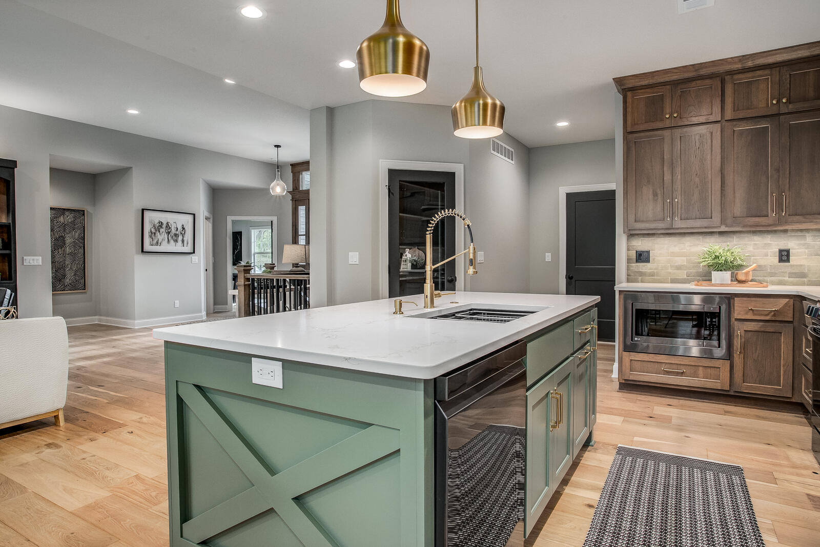 Stylish half-bath remodel with bold black paneling and elegant gold lighting by Top Shelf Home Builders Stylish half-bath remodel with bold black paneling and elegant gold lighting by Top Shelf Home Builders