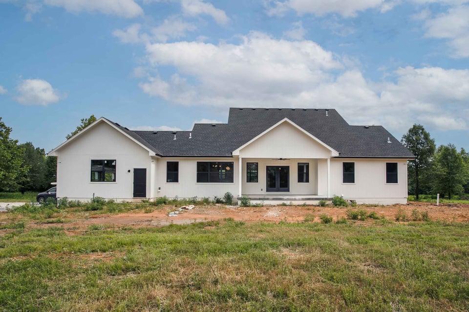 exterior shot of a large custom home in kansas city with white exterior (1)