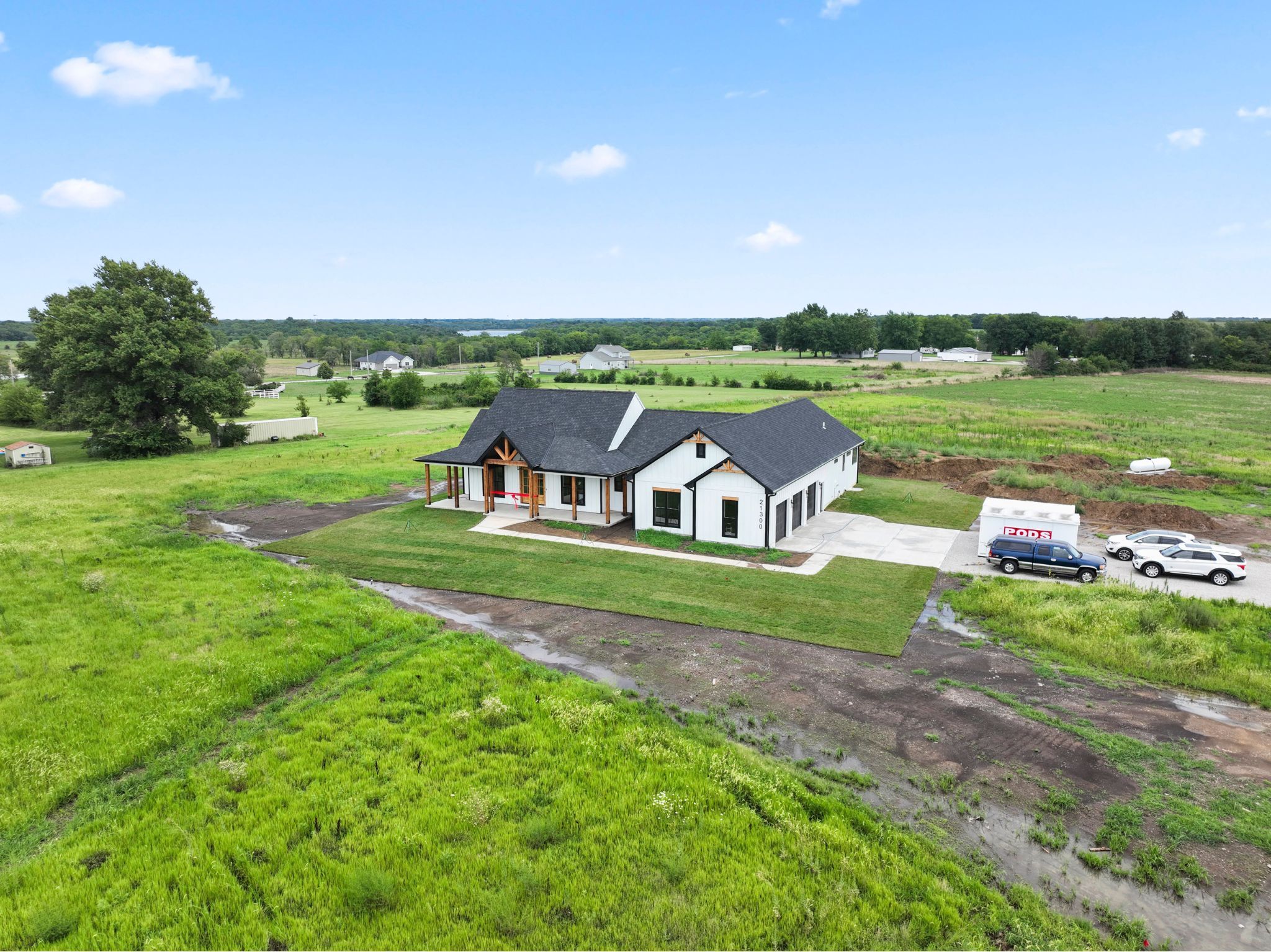 white modern farmhouse custom home in pleasant hill, mo